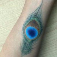 Feather arm paint - Olivian Face Paint